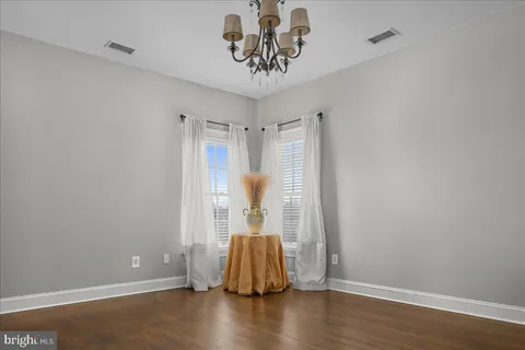 a view of room with window and hardwood floor