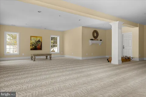 a view of a livingroom with a flat screen tv and windows