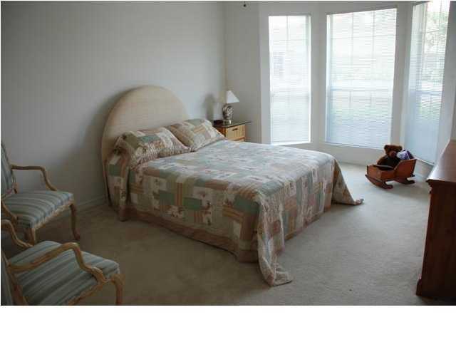 3900 Mesa Road Destin, FL 32541 - Photo 10 of 12 a bedroom with a bed and a large window