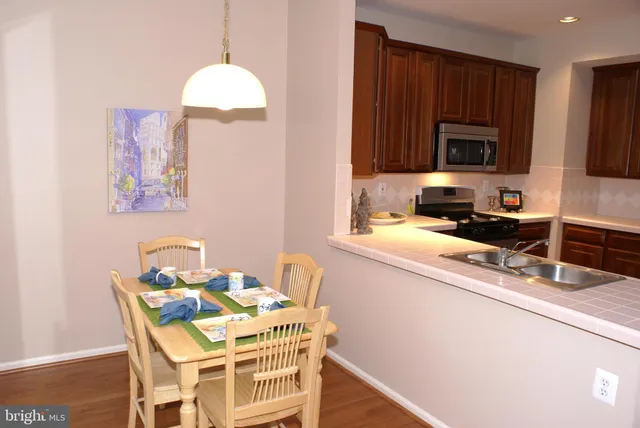 a kitchen with a sink cabinets and window