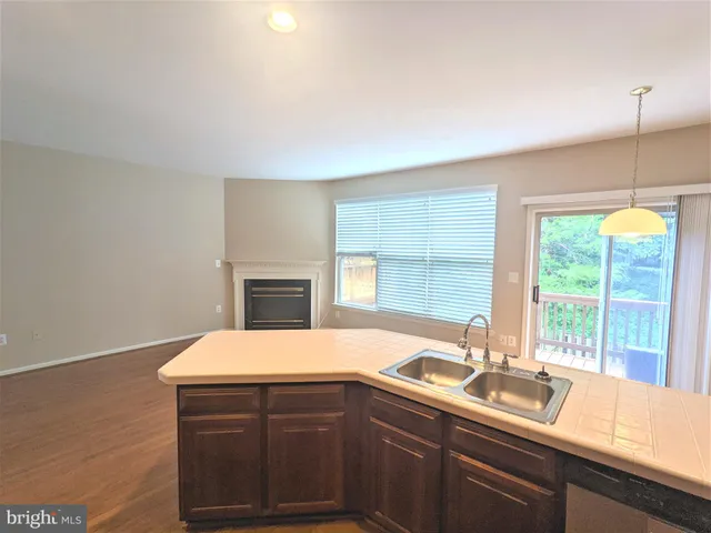 a kitchen with a sink and a window