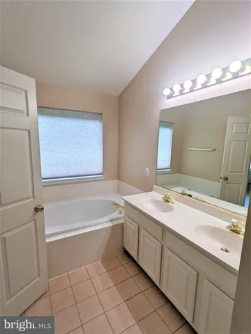 a bathroom with a sink a vanity and a mirror