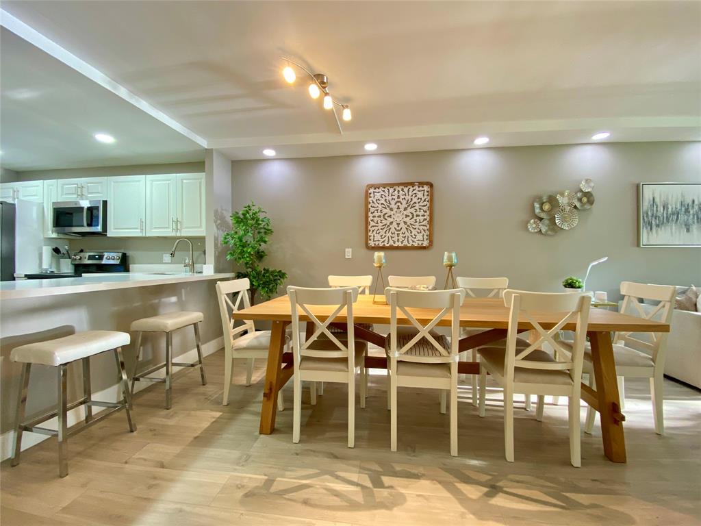 3010 North Course Drive, Unit 209 Pompano Beach, FL 33069 - Photo 8 of 39 a view of a dining room with furniture