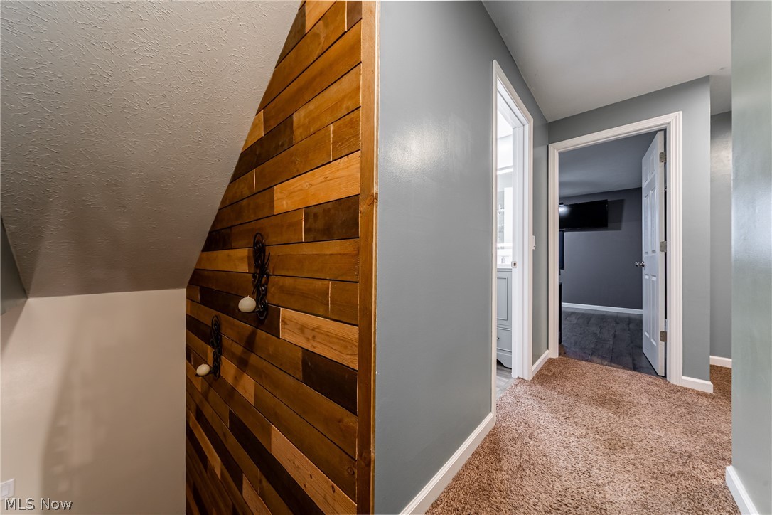 7791 Ridge Road Parma, OH 44129 - Photo 16 of 41 Hallway with light colored carpet and baseboards