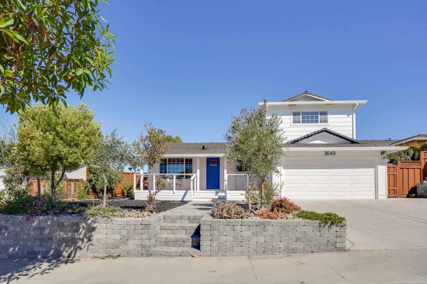 3649 Rowley Drive San Jose, CA 95132 - Photo 1 of 49 a front view of a house with a tree