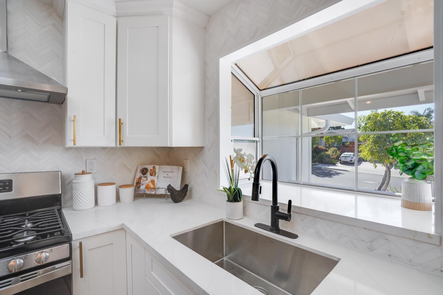 3649 Rowley Drive San Jose, CA 95132 - Photo 11 of 49 a kitchen with a sink and a stove top oven