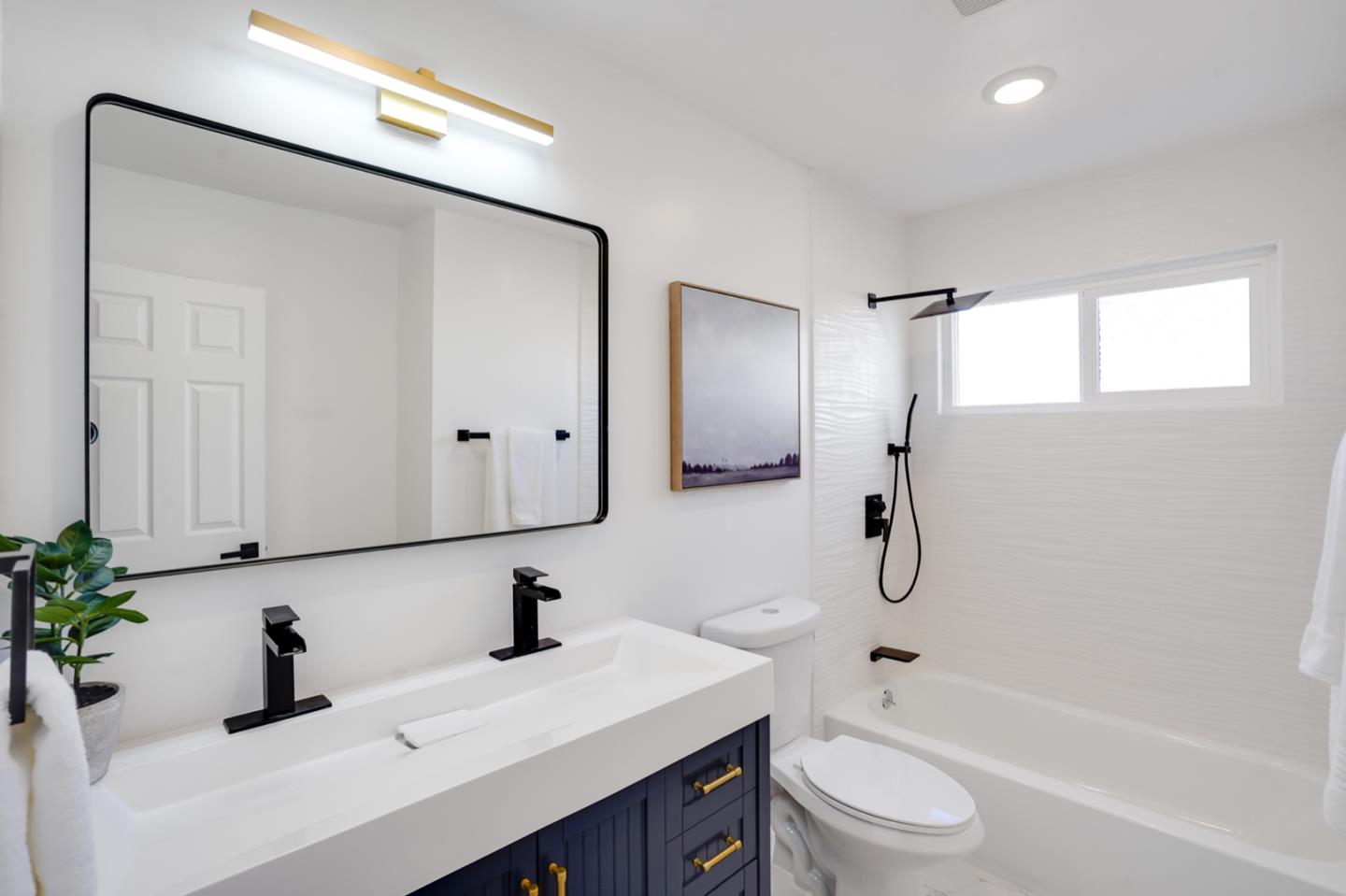 3649 Rowley Drive San Jose, CA 95132 - Photo 16 of 49 a bathroom with a sink a toilet and shower