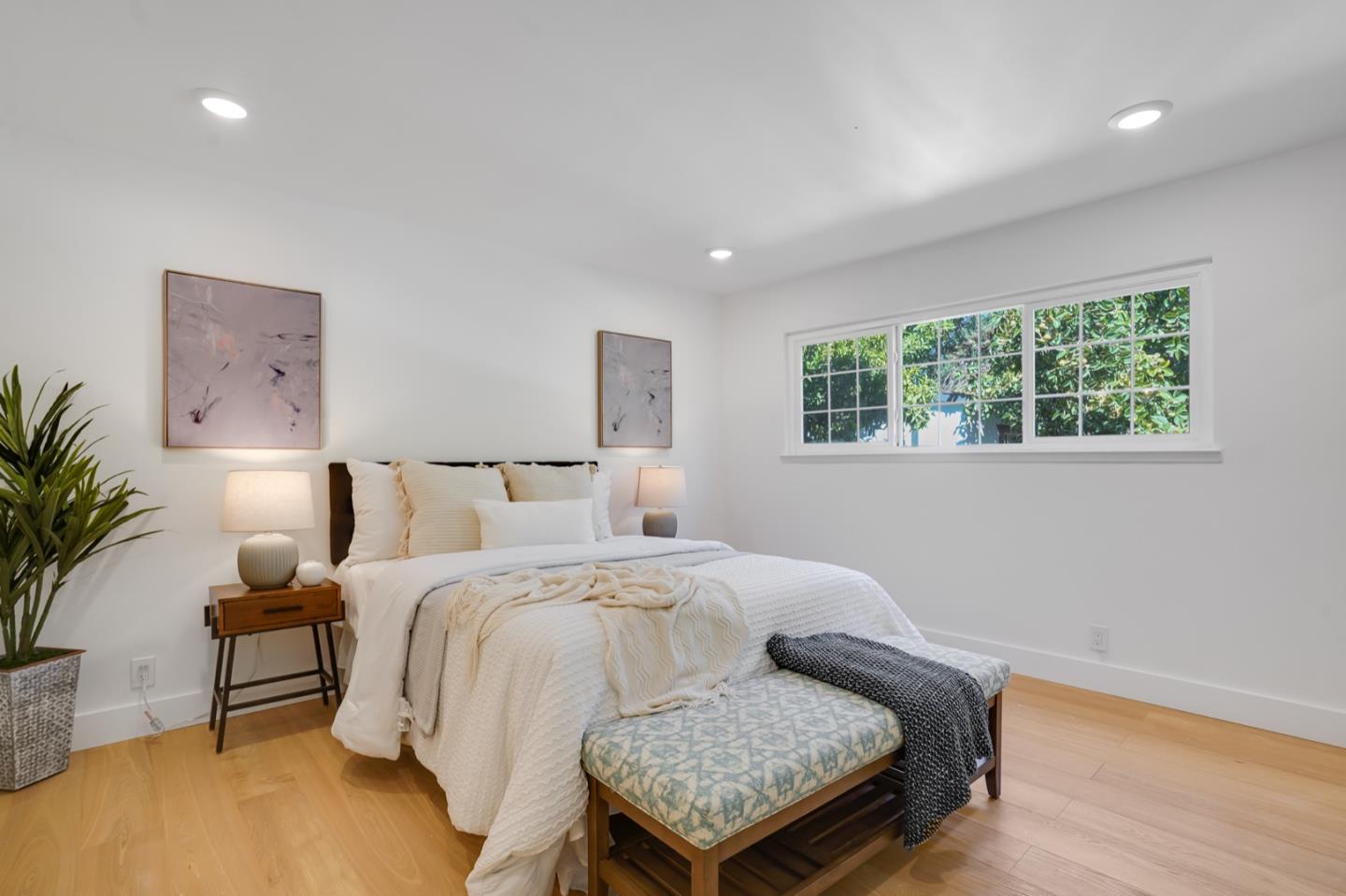3649 Rowley Drive San Jose, CA 95132 - Photo 19 of 49 a bedroom with a bed and a potted plant on dresser
