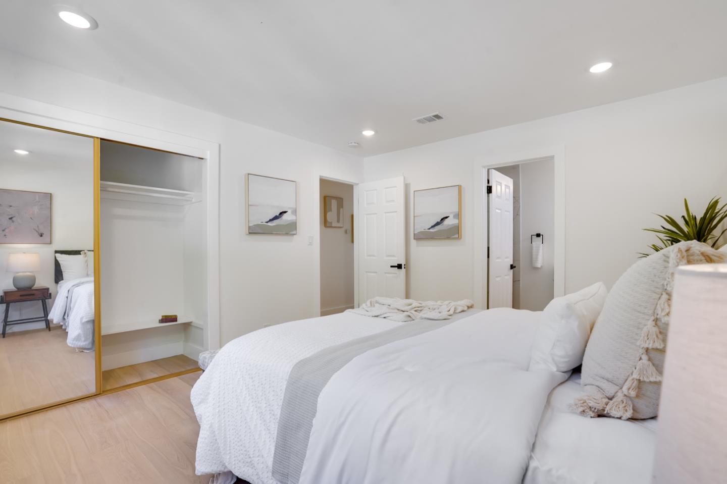 3649 Rowley Drive San Jose, CA 95132 - Photo 21 of 49 a bedroom with a large bed and a chandelier