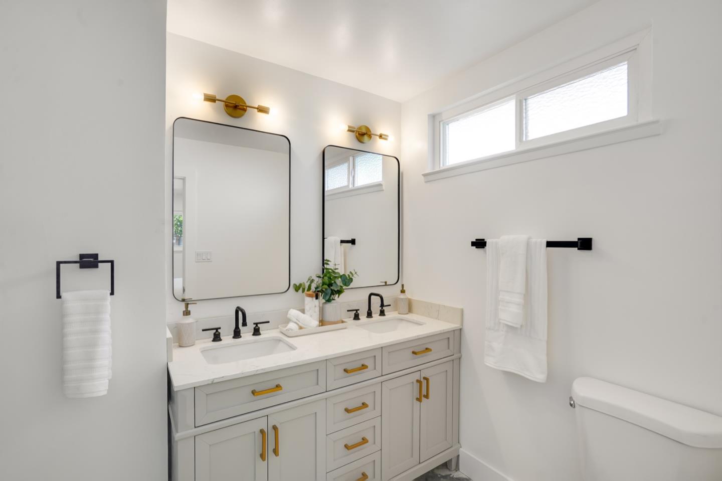 3649 Rowley Drive San Jose, CA 95132 - Photo 23 of 49 a bathroom with a double vanity sink a mirror and a shower