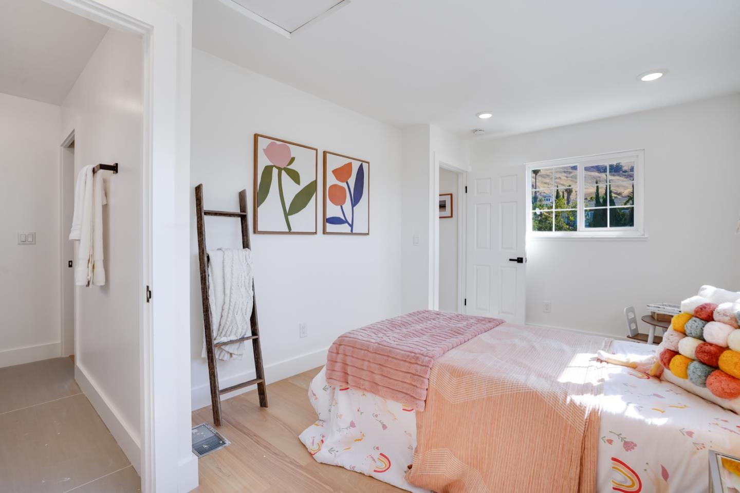 3649 Rowley Drive San Jose, CA 95132 - Photo 27 of 49 a bedroom with a bed and a window