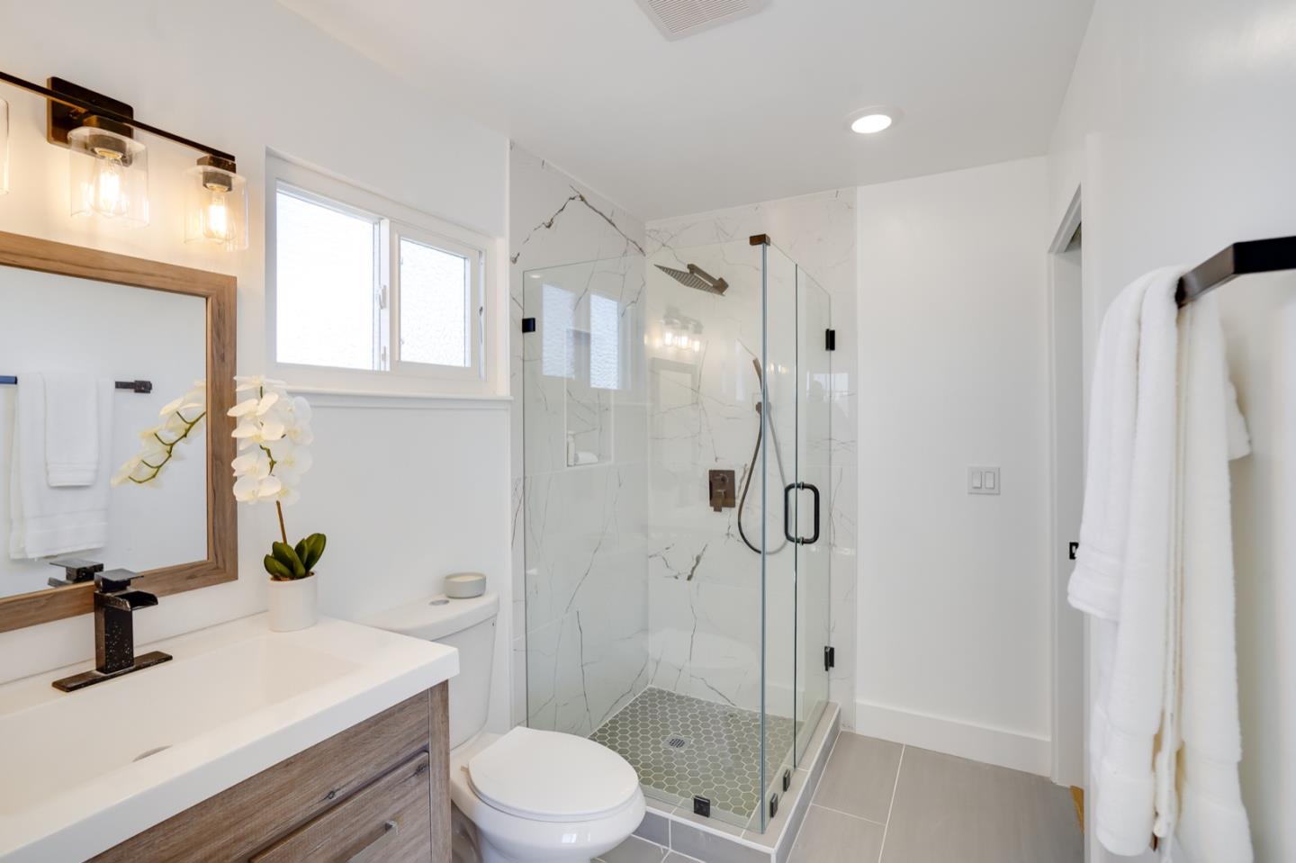 3649 Rowley Drive San Jose, CA 95132 - Photo 28 of 49 a bathroom with a sink toilet and shower
