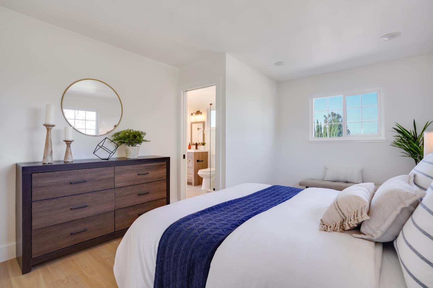 3649 Rowley Drive San Jose, CA 95132 - Photo 30 of 49 a bedroom with a bed and a mirror on dresser
