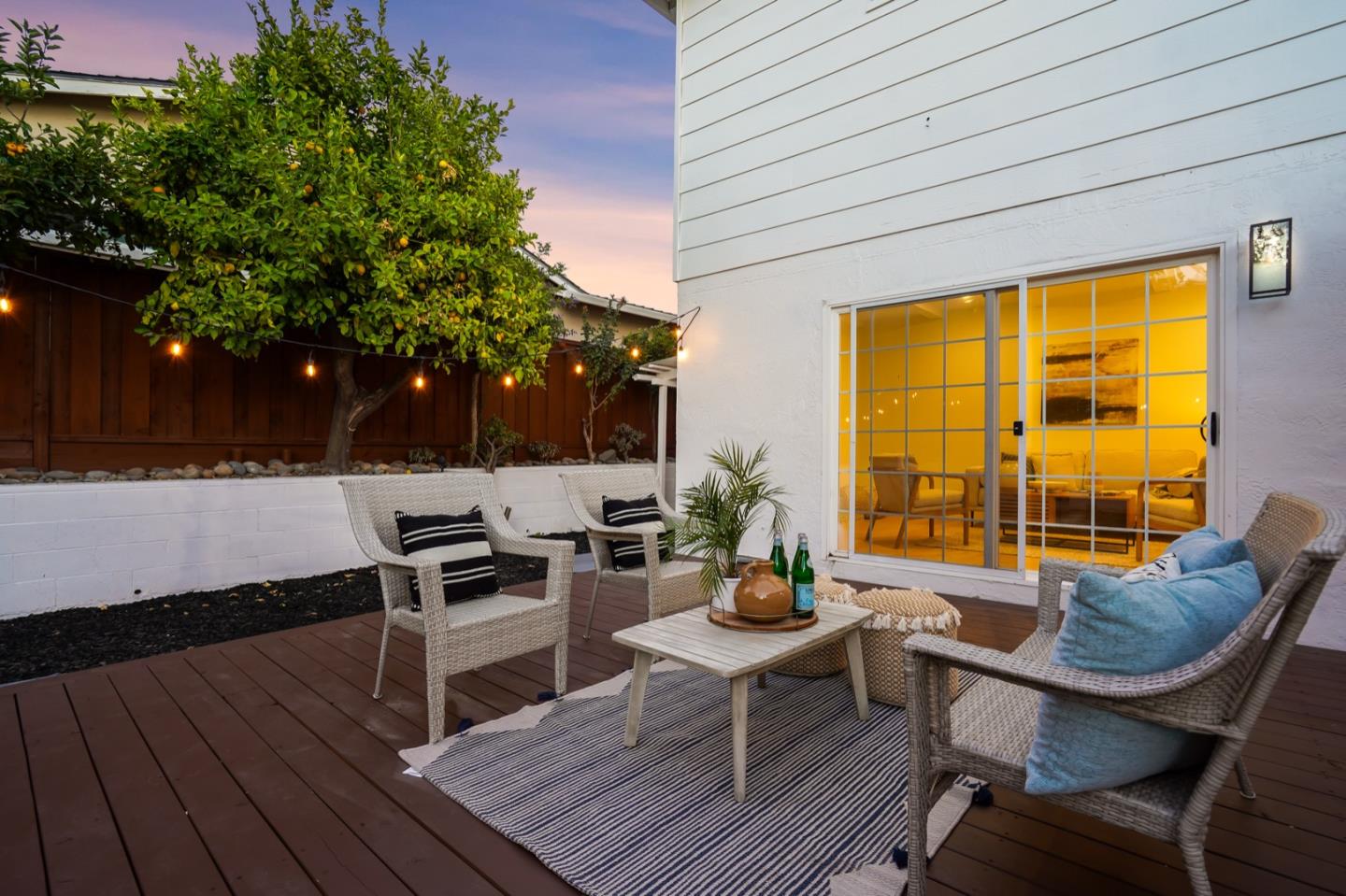 3649 Rowley Drive San Jose, CA 95132 - Photo 46 of 49 a view of a patio with couches and table and chairs with wooden floor and fence