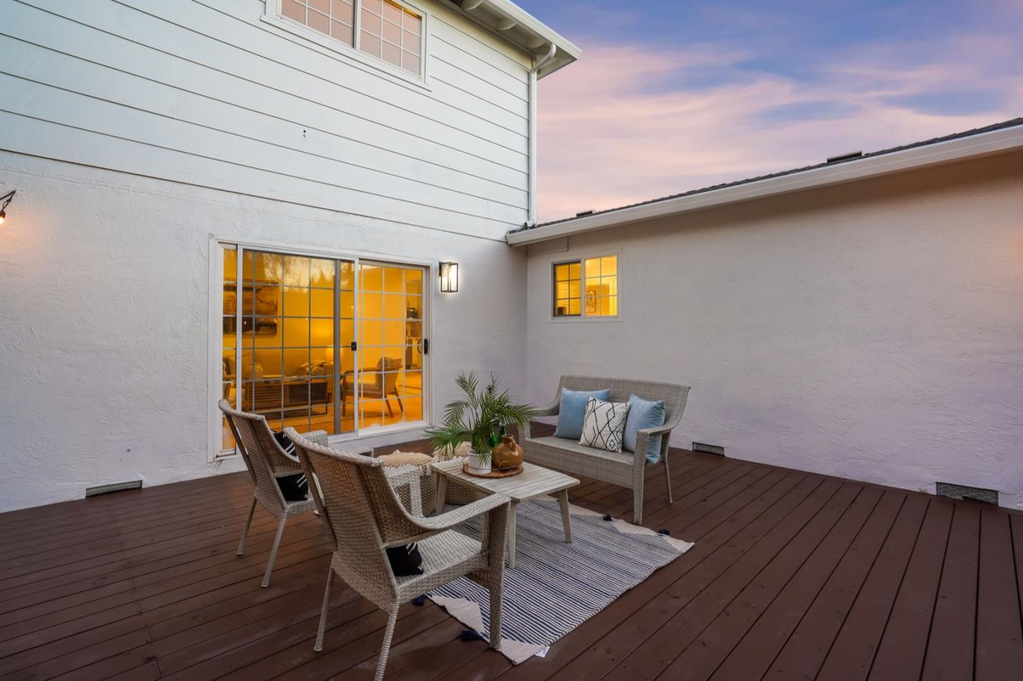 3649 Rowley Drive San Jose, CA 95132 - Photo 47 of 49 a view of a patio with table and chairs with wooden floor and fence