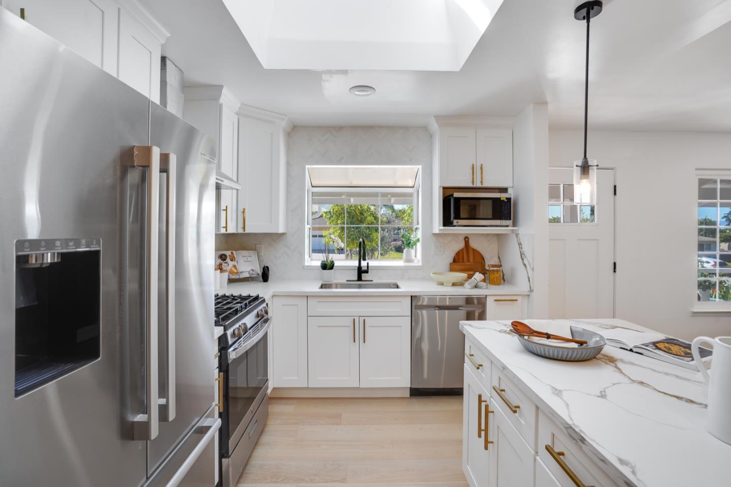 3649 Rowley Drive San Jose, CA 95132 - Photo 9 of 49 a kitchen with a sink stove and refrigerator