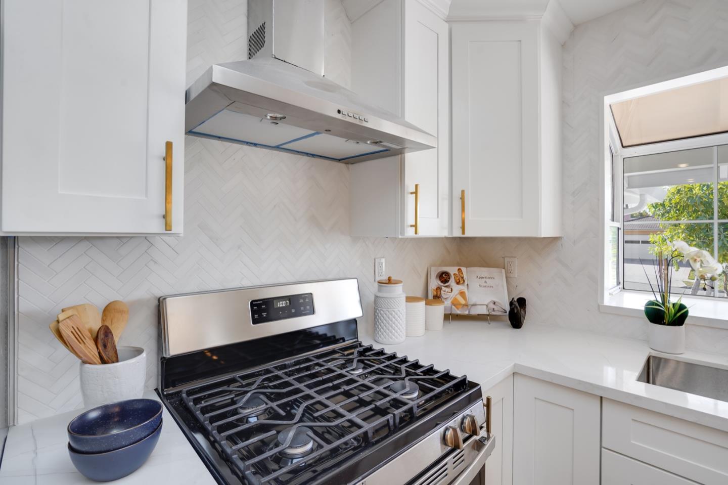3649 Rowley Drive San Jose, CA 95132 - Photo 10 of 49 a kitchen with a stove and cabinets