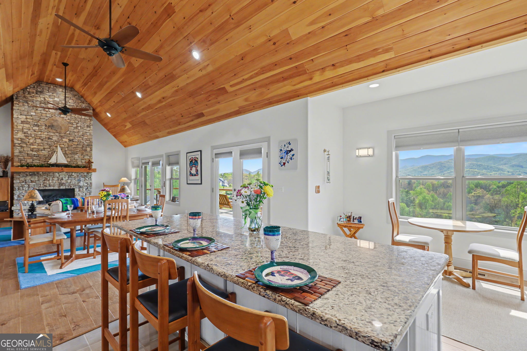 100 Deacons Way Franklin, NC 28734 - Photo 12 of 53 a view of a dining room with furniture a fireplace and wooden floor