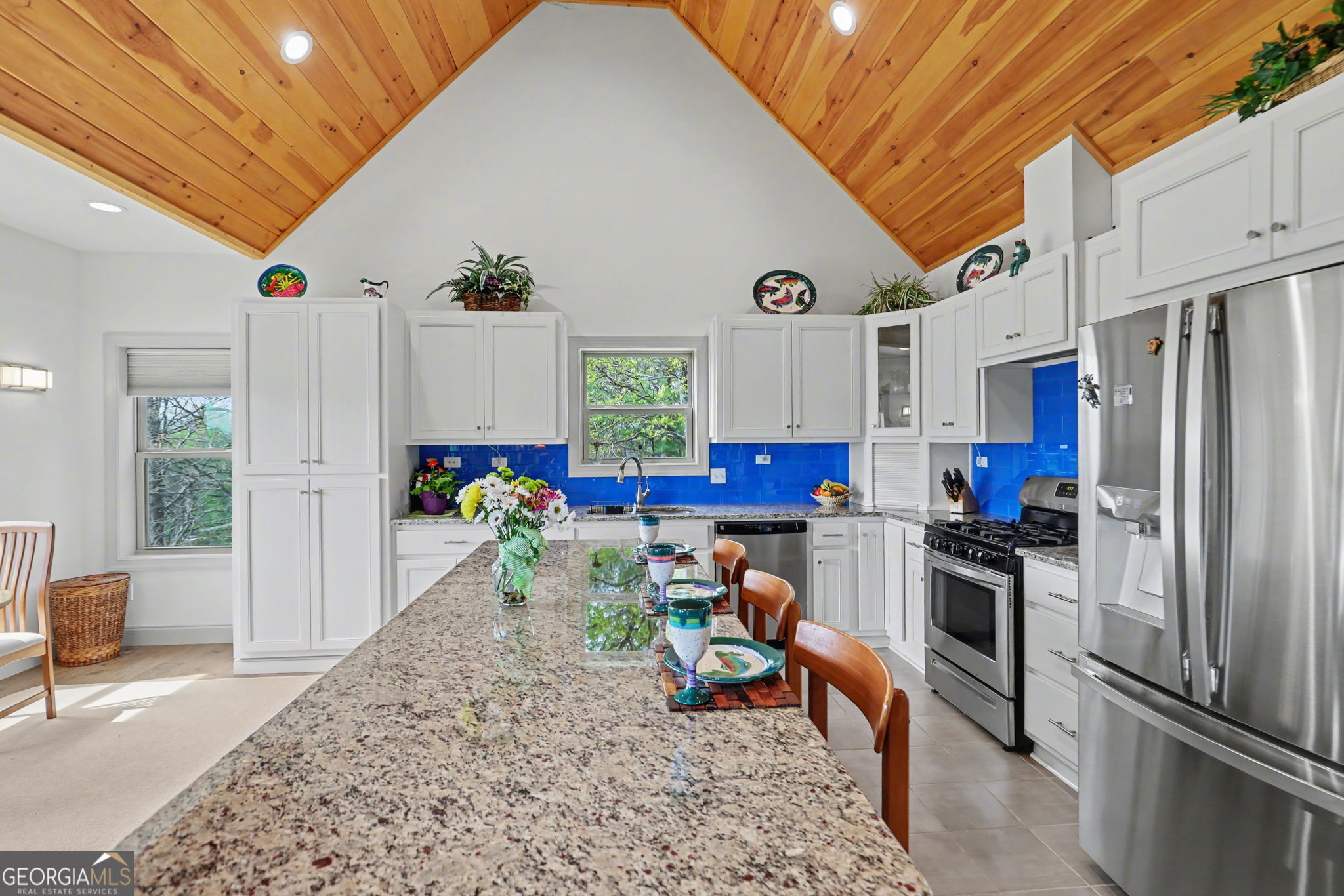 100 Deacons Way Franklin, NC 28734 - Photo 15 of 53 a kitchen with refrigerator and chairs