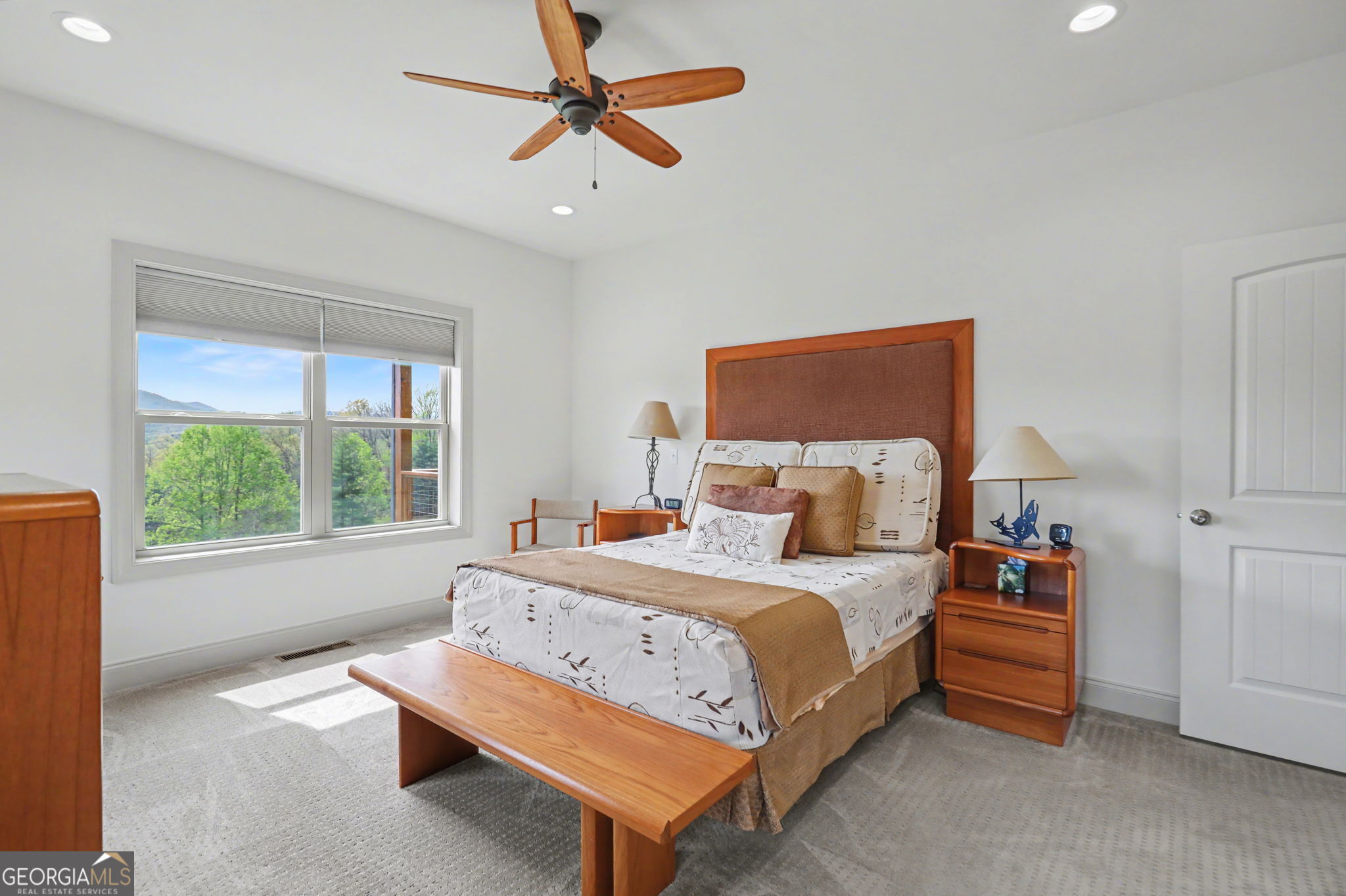 100 Deacons Way Franklin, NC 28734 - Photo 21 of 53 a bedroom with a bed a window and a chandelier