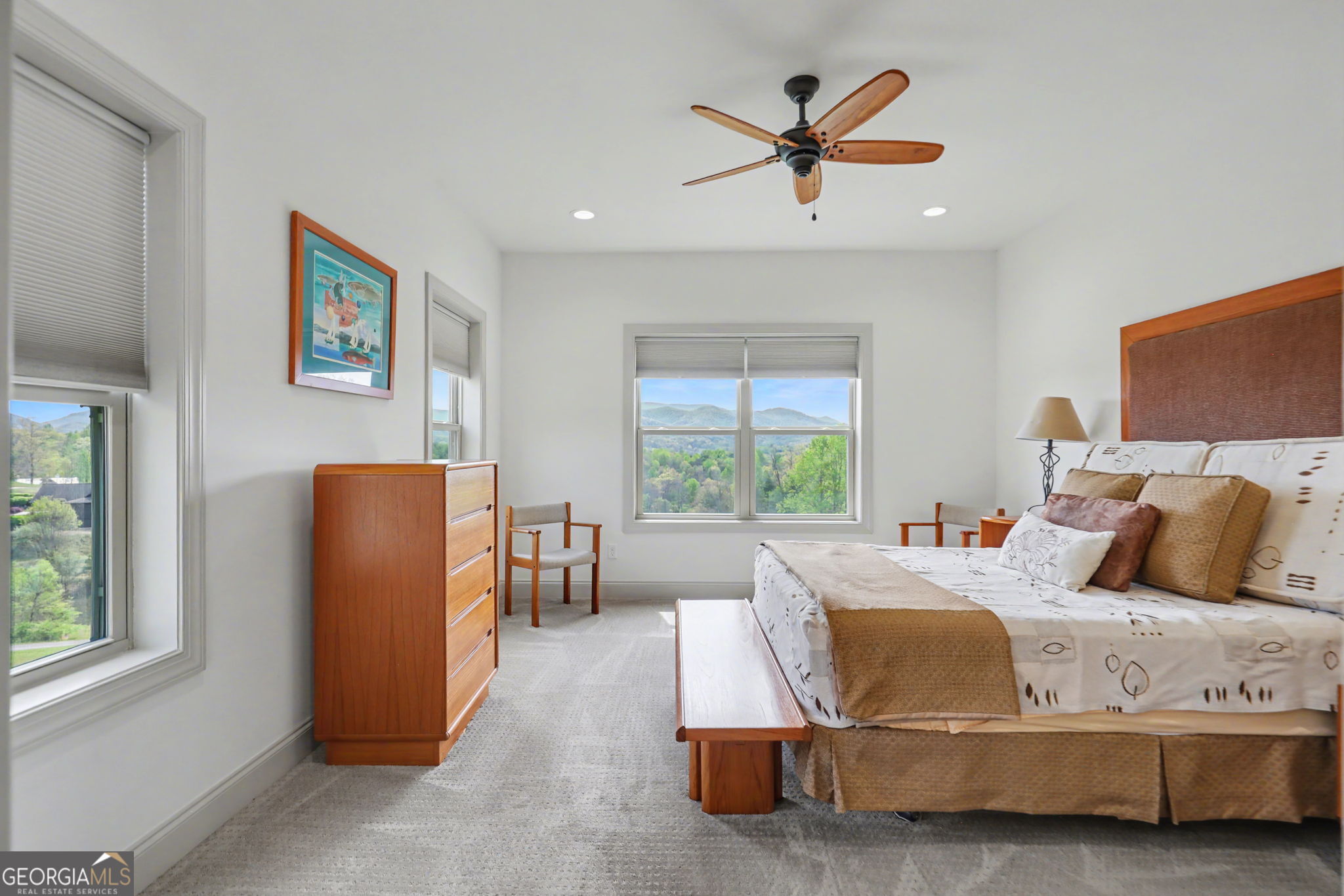 100 Deacons Way Franklin, NC 28734 - Photo 25 of 53 a bedroom with a bed and a chandelier