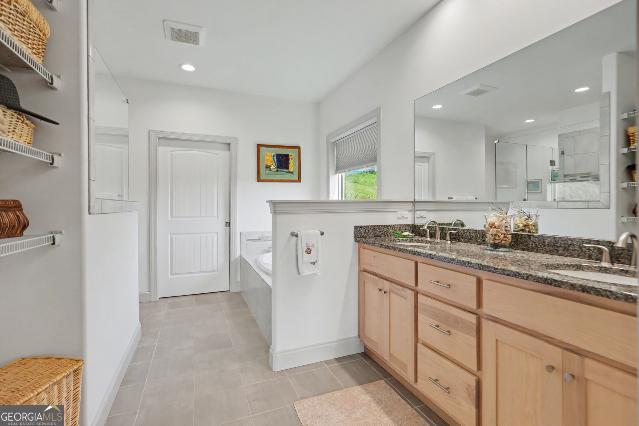 100 Deacons Way Franklin, NC 28734 - Photo 26 of 53 a spacious bathroom with a granite countertop sink and a mirror
