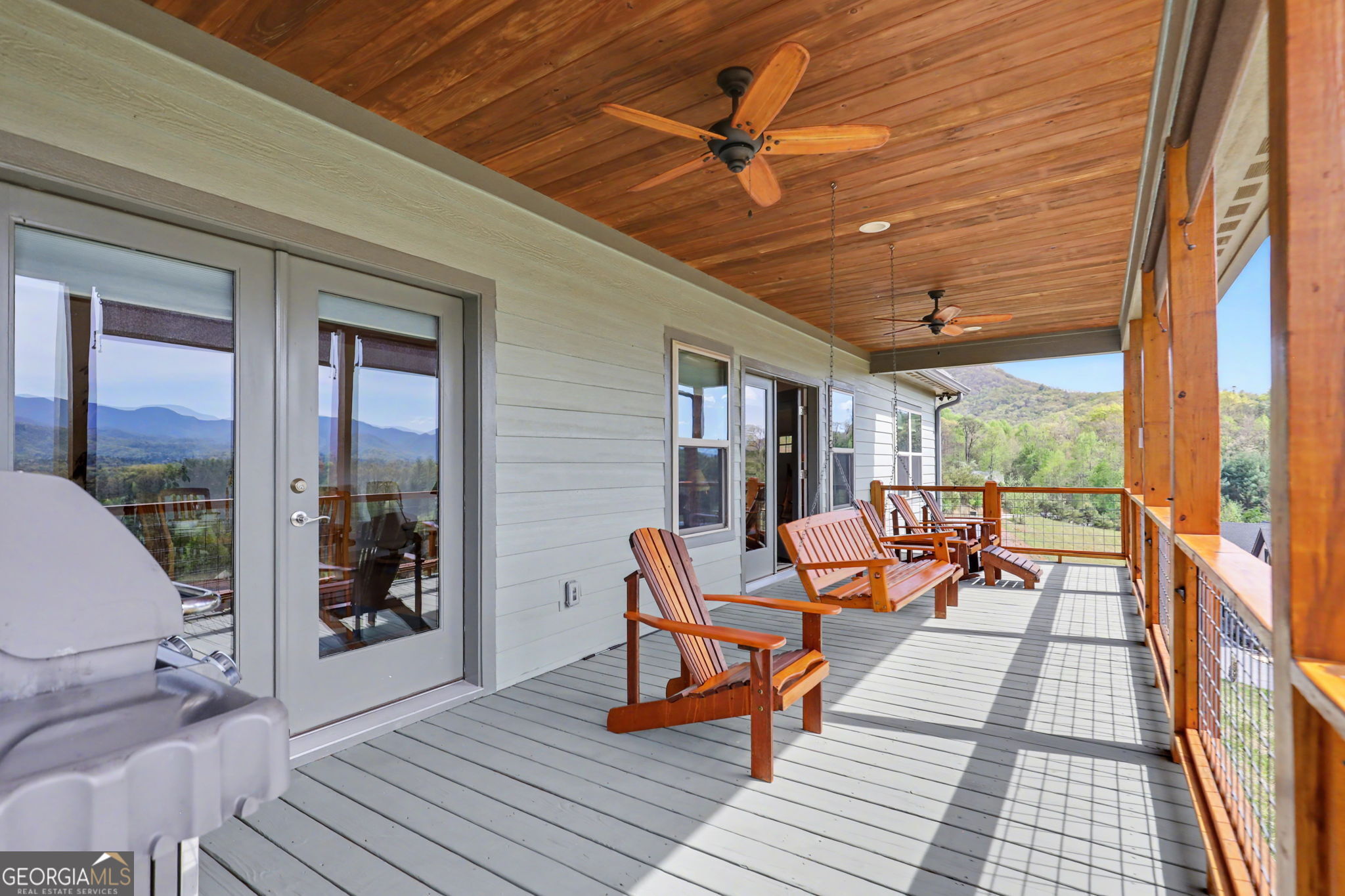 100 Deacons Way Franklin, NC 28734 - Photo 31 of 53 a outdoor space with patio the couches and a dining table with the view of the balcony