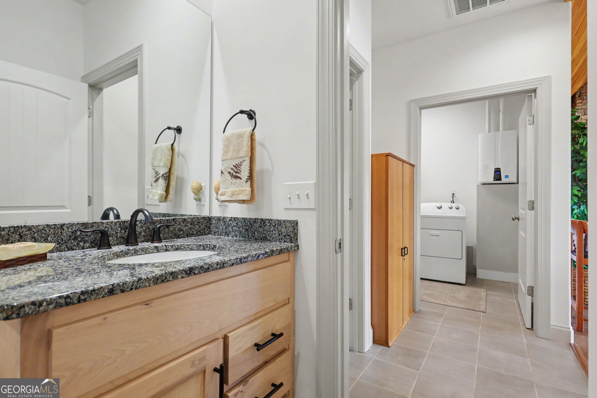 100 Deacons Way Franklin, NC 28734 - Photo 32 of 53 a bathroom with a granite countertop sink and a mirror