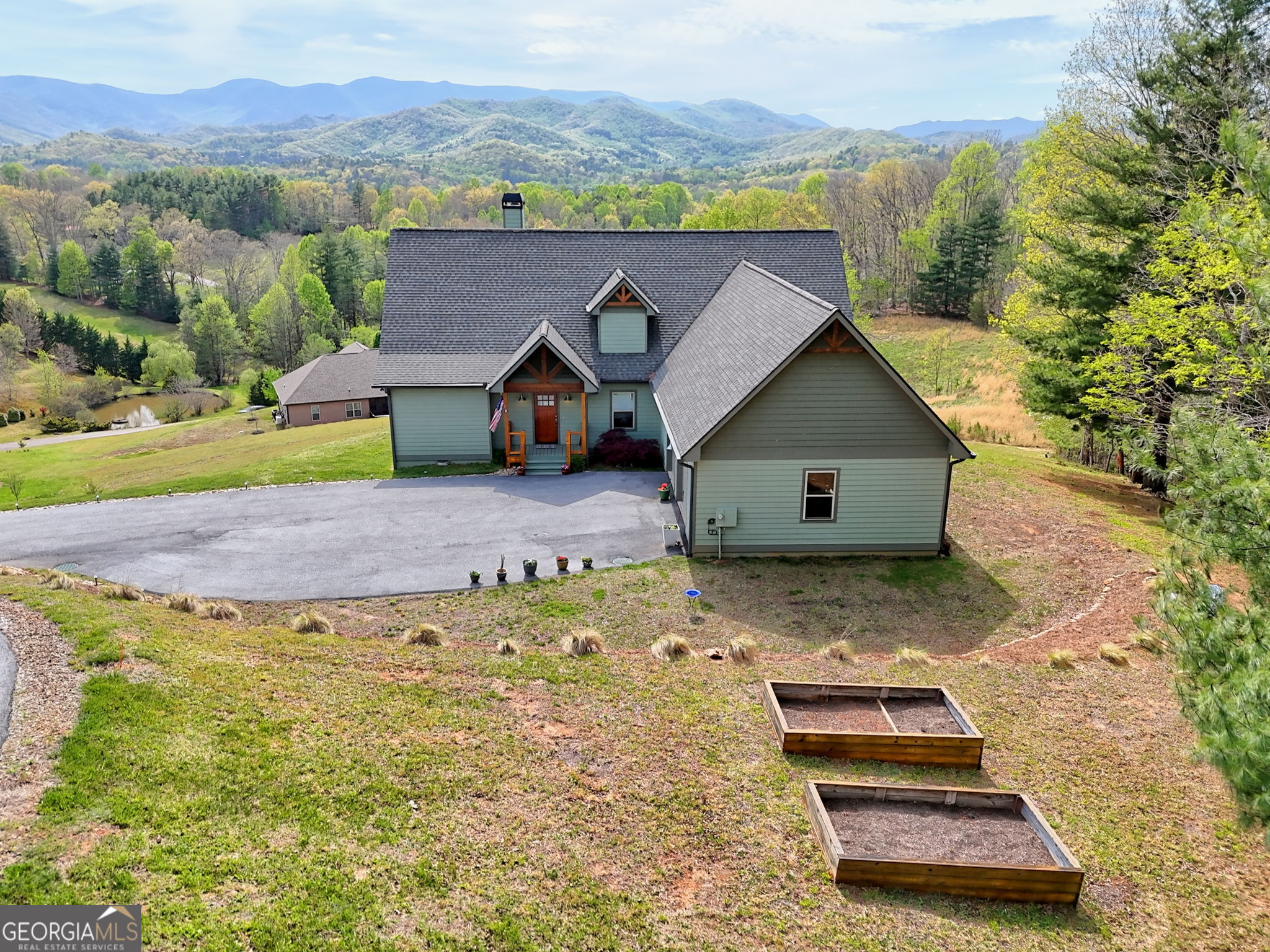 100 Deacons Way Franklin, NC 28734 - Photo 49 of 53 a view of a house with a yard and sitting area
