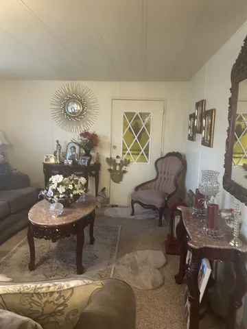 a living room with furniture and a table