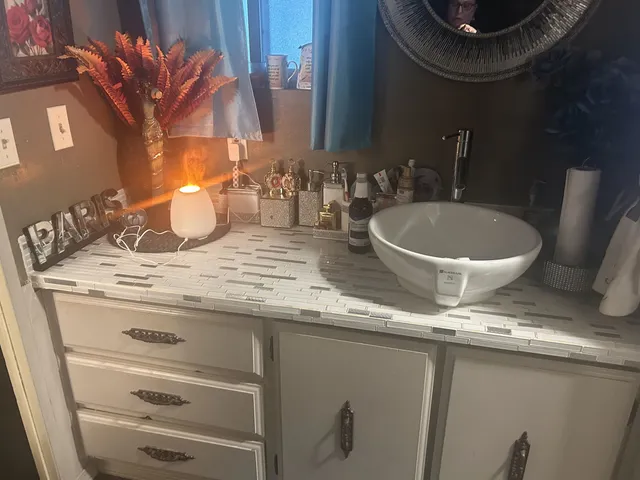 a bathroom with a sink and a mirror
