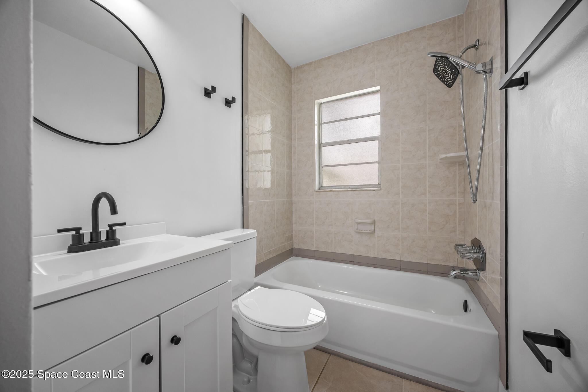 287 Edward Road Melbourne, FL 32904 - Photo 15 of 22 a bathroom with a sink toilet and shower