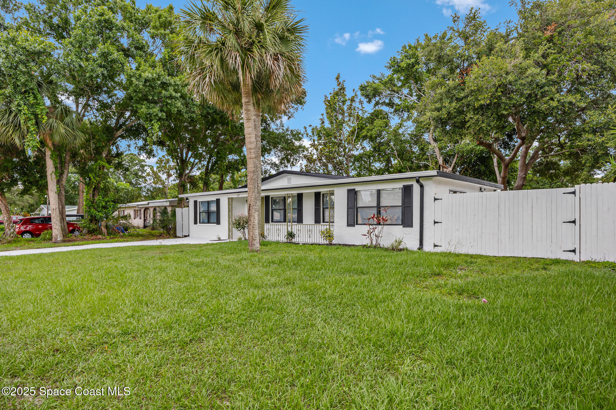 287 Edward Road Melbourne, FL 32904 - Photo 21 of 22 a front view of a house with a garden