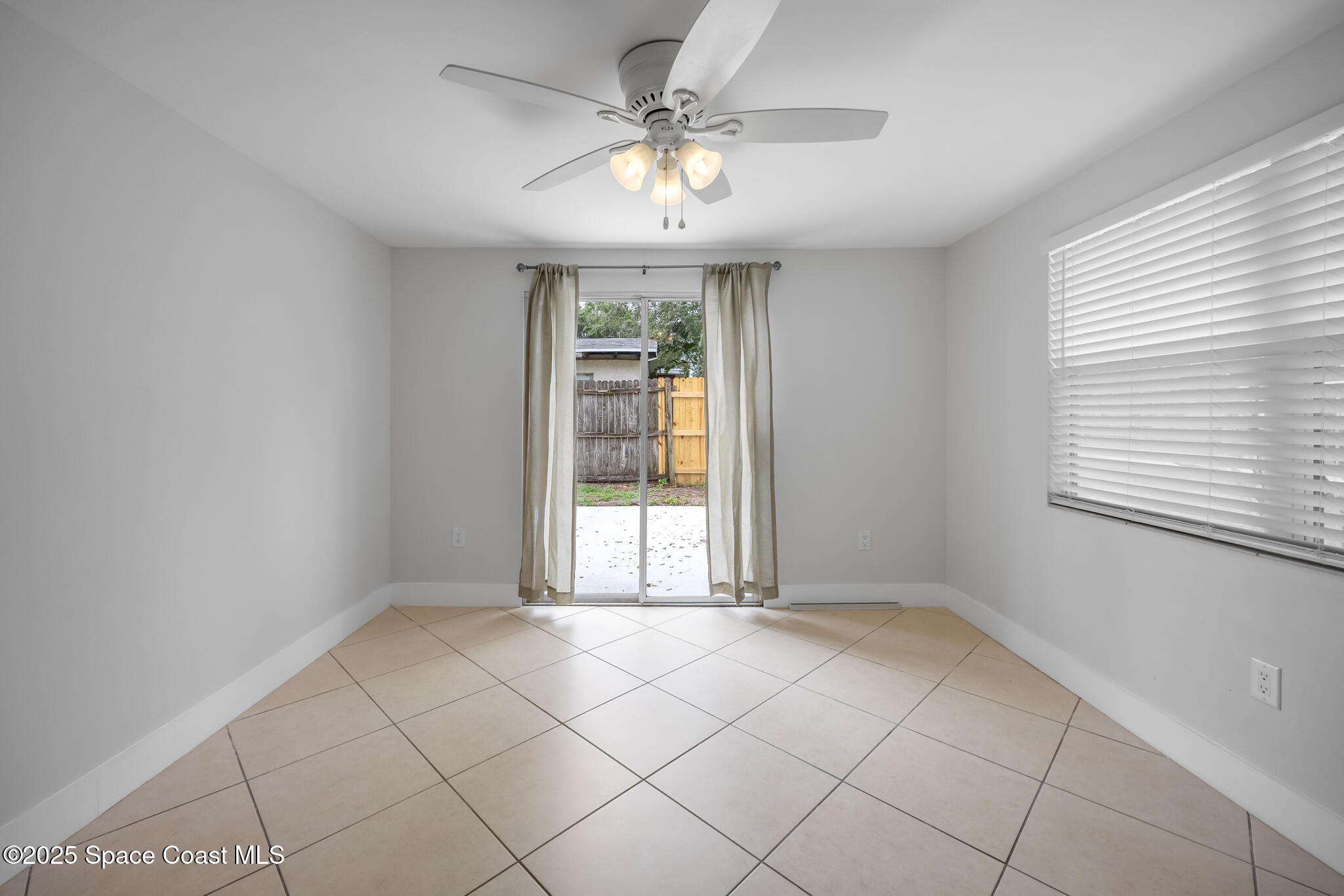 287 Edward Road Melbourne, FL 32904 - Photo 10 of 22 a view of an empty room with a window