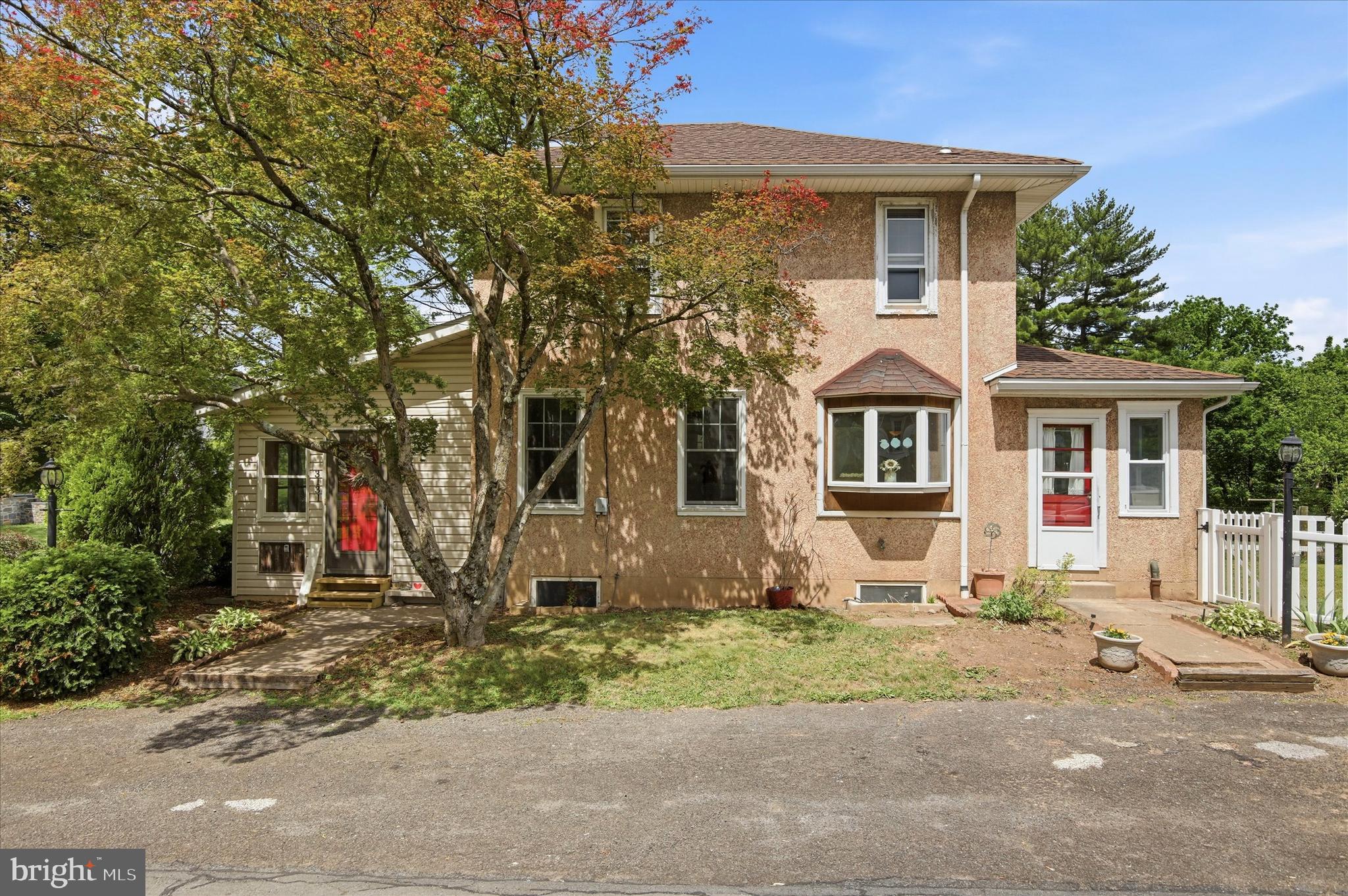 3131 Bedminster Road Ottsville, PA 18942 - Photo 23 of 23 a view of a house with a yard and large tree