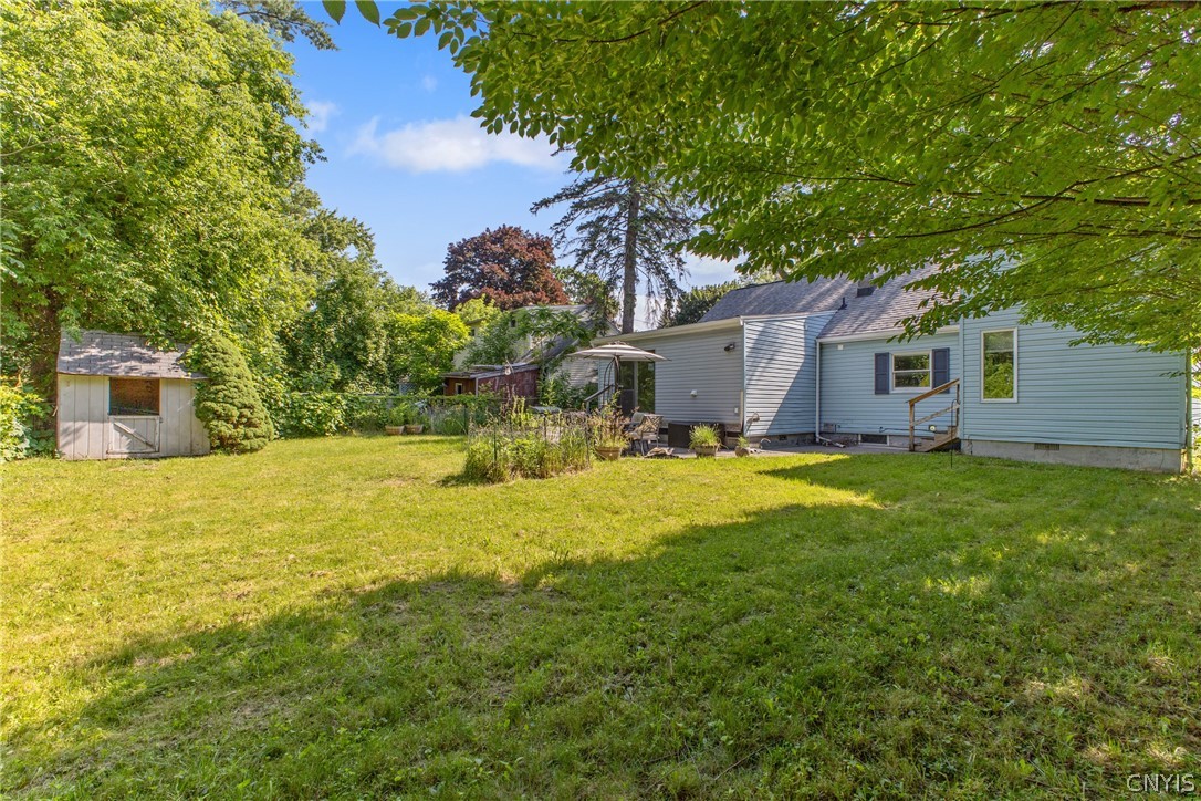 125 Circle Road Salina, NY 13212 - Photo 35 of 39 Nice size backyard, fully fenced in with several garden beds and a patio space, great for entertaining!