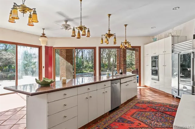 a very nice looking living room with a large window