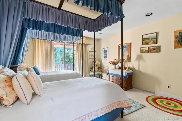 a bedroom with a bed a table and chair