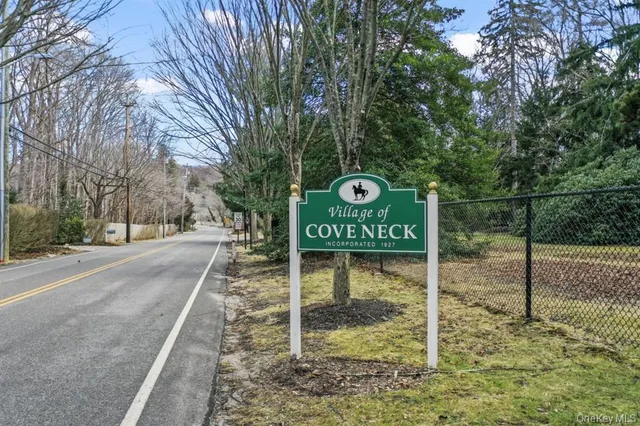a view of a park that has a sign board