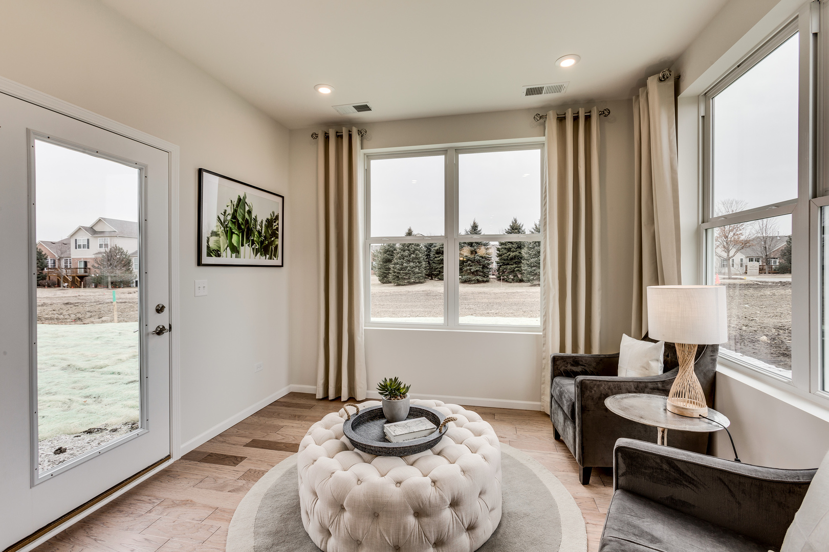 825 Spring Drive Lindenhurst, IL 60046 - Photo 11 of 29 a bedroom with furniture and a large window