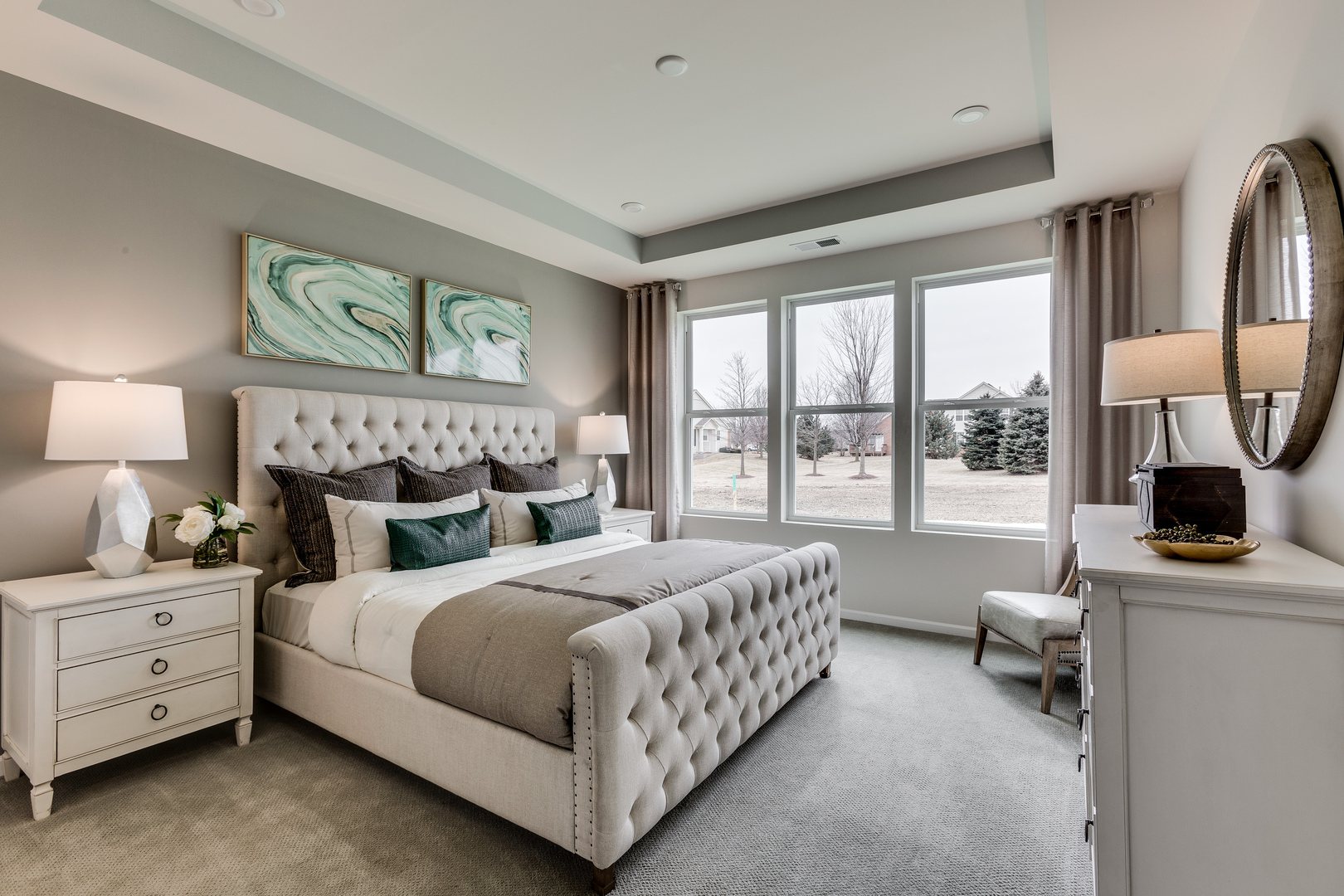 825 Spring Drive Lindenhurst, IL 60046 - Photo 12 of 29 a bedroom with a bed a table and three large window