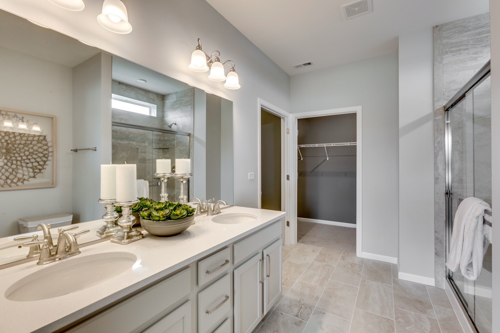 825 Spring Drive Lindenhurst, IL 60046 - Photo 14 of 29 a bathroom with a double vanity sink and a mirror