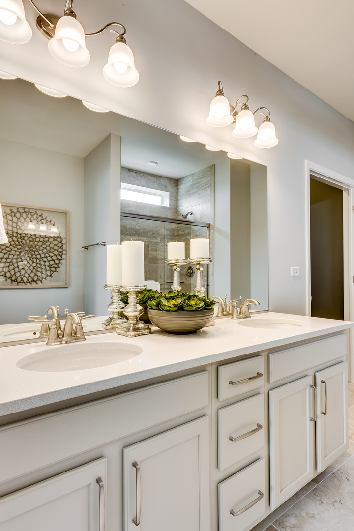 825 Spring Drive Lindenhurst, IL 60046 - Photo 15 of 29 a bathroom with a sink and a mirror
