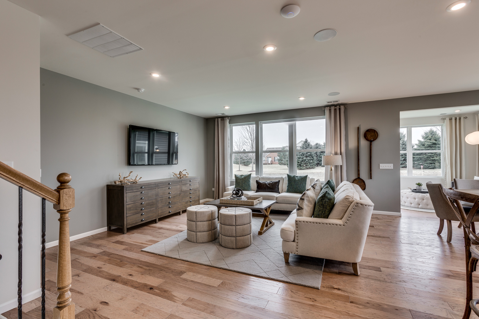 825 Spring Drive Lindenhurst, IL 60046 - Photo 2 of 29 a living room with furniture and a flat screen tv