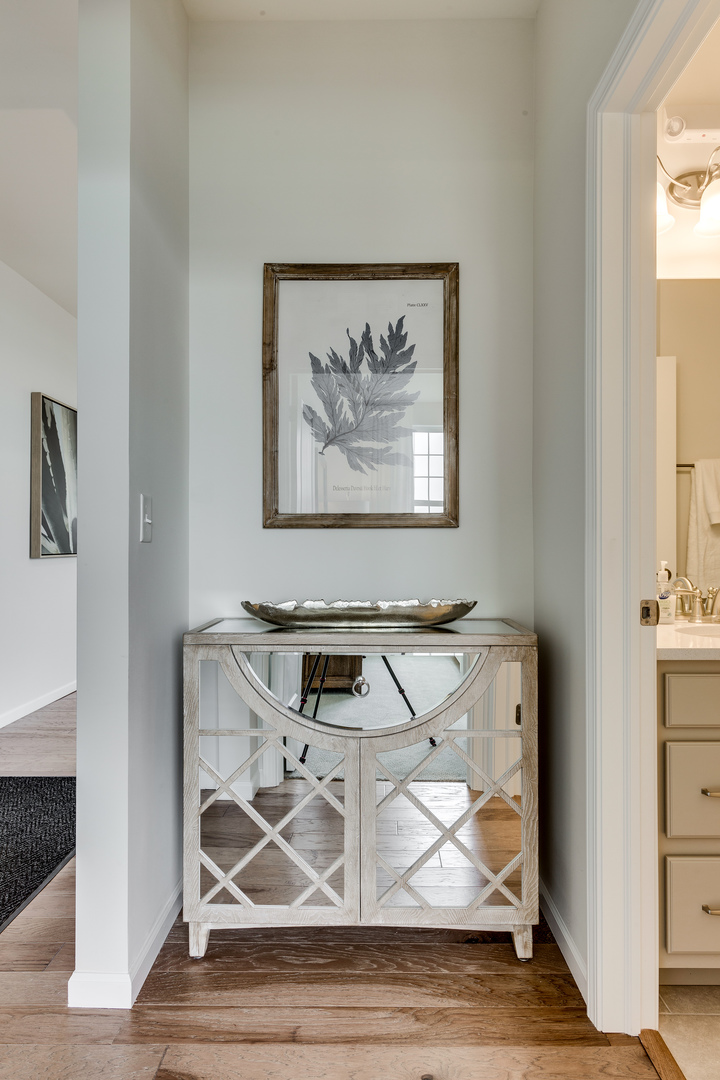 825 Spring Drive Lindenhurst, IL 60046 - Photo 22 of 29 a view of a livingroom with wooden floor and a flat screen tv