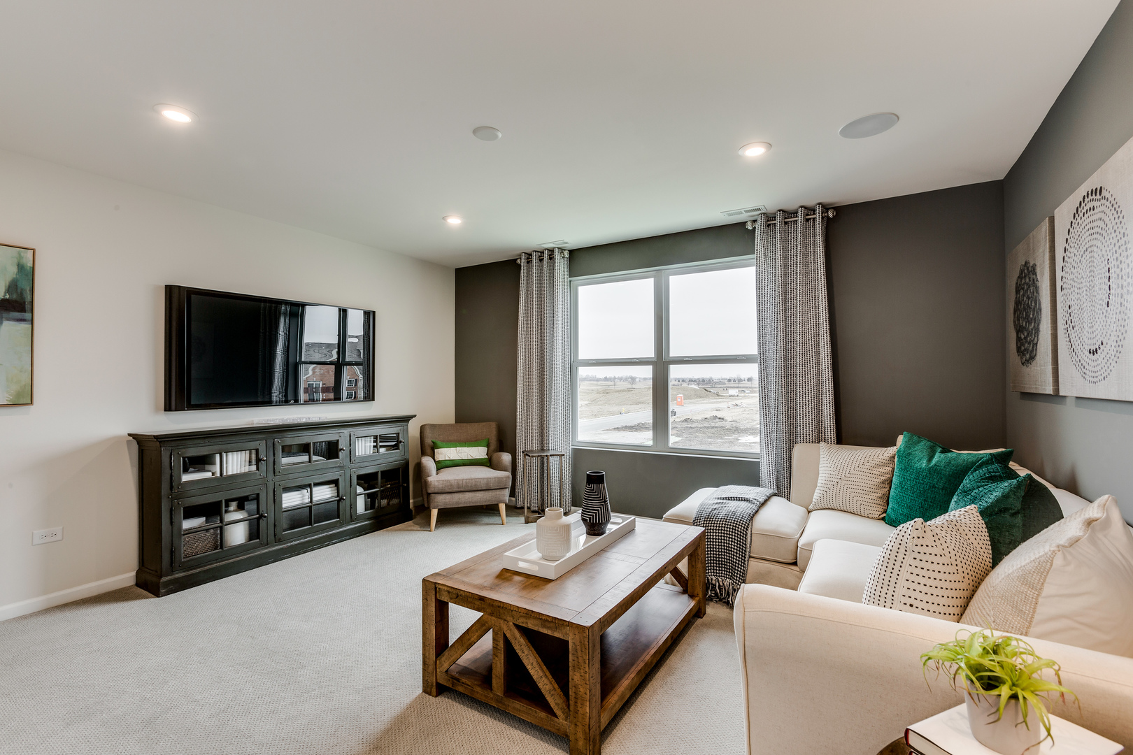 825 Spring Drive Lindenhurst, IL 60046 - Photo 27 of 29 a living room with furniture and a flat screen tv