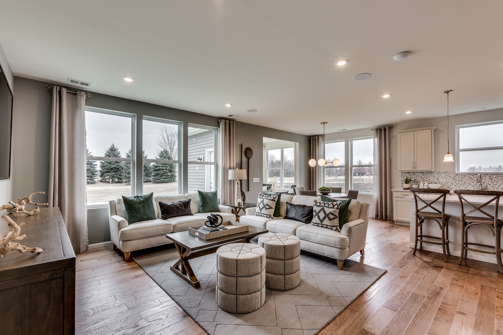 825 Spring Drive Lindenhurst, IL 60046 - Photo 3 of 29 a living room with furniture and a large window