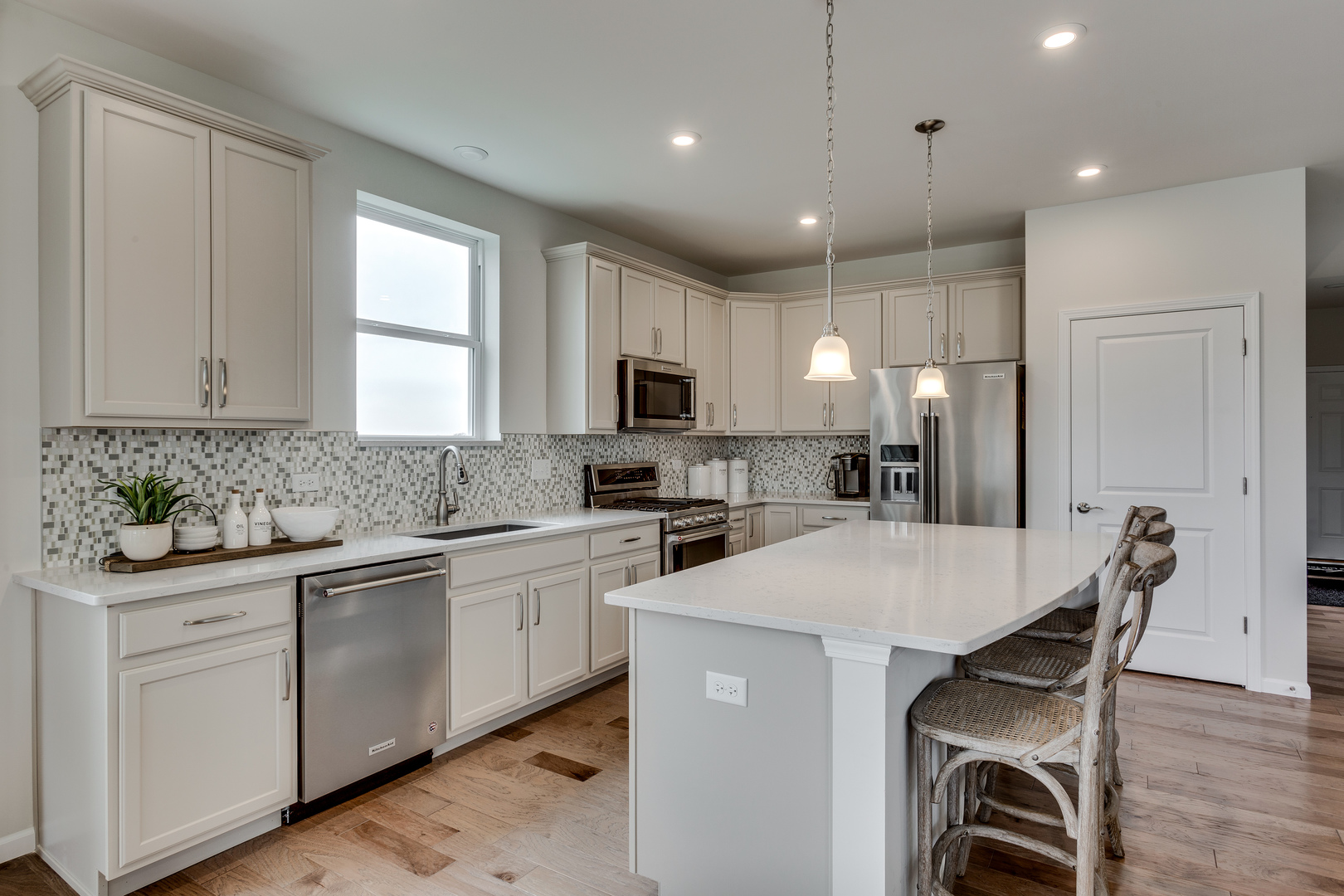 825 Spring Drive Lindenhurst, IL 60046 - Photo 7 of 29 a kitchen with white cabinets and sink