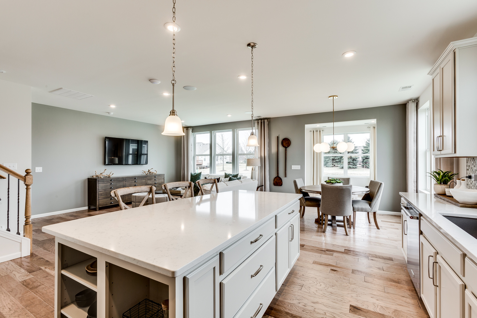 825 Spring Drive Lindenhurst, IL 60046 - Photo 8 of 29 a large kitchen with kitchen island a sink table and chairs