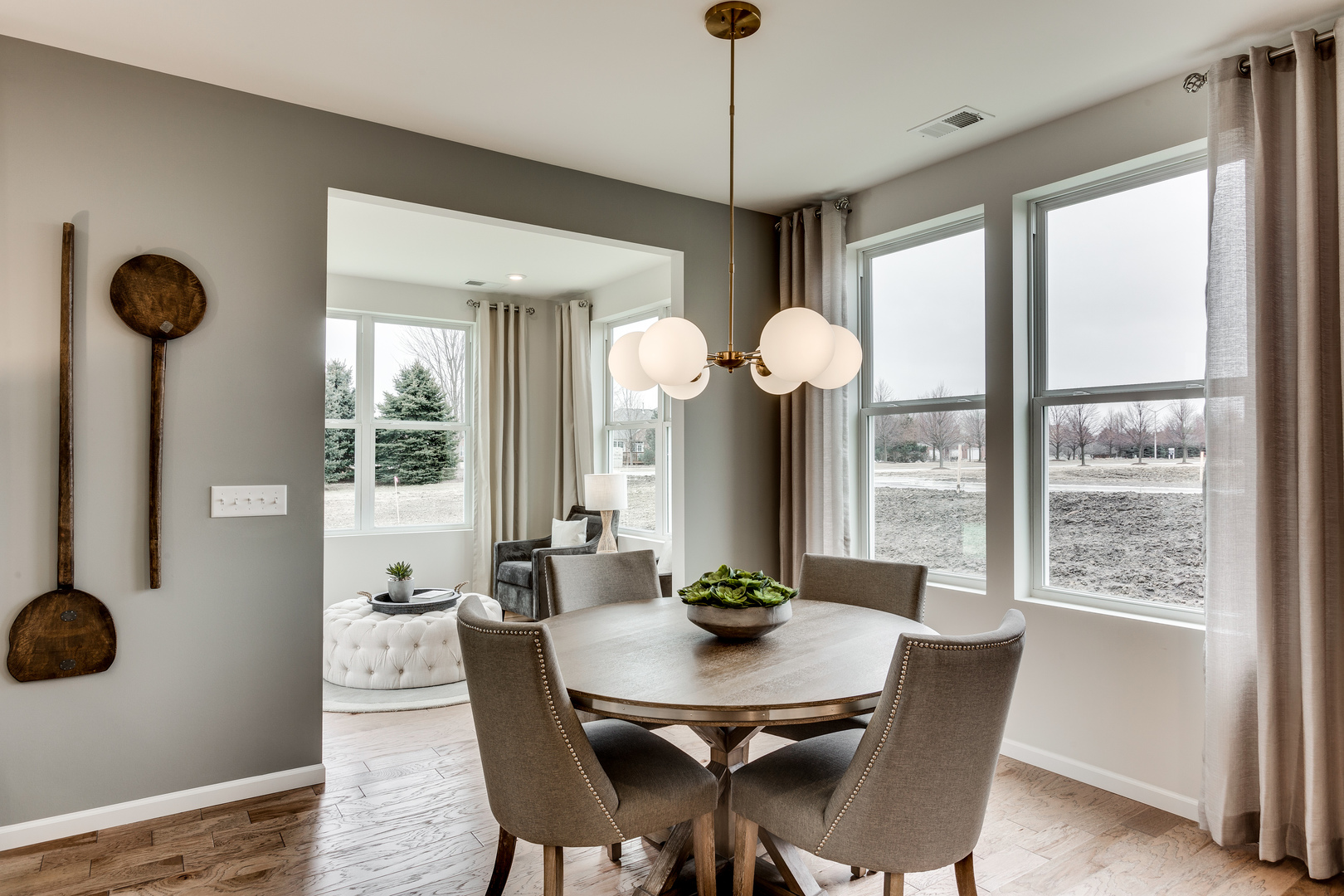 825 Spring Drive Lindenhurst, IL 60046 - Photo 9 of 29 a view of a dining room with furniture window and wooden floor